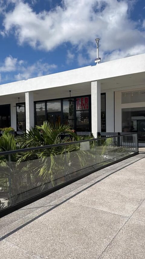 The Bal Harbour Shops exterior walkway and Red Market storefront, Miami