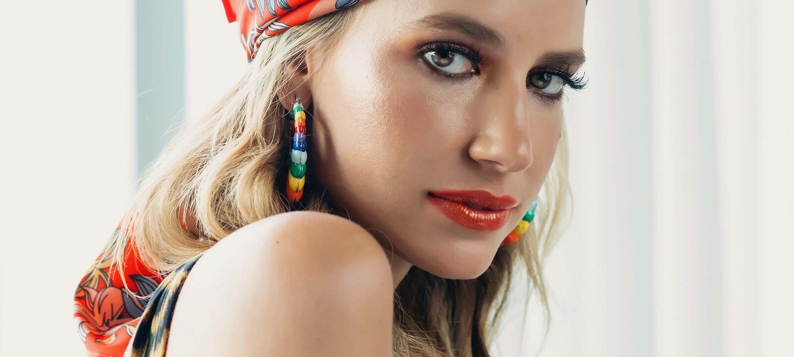 A beauty portrait with a headscarf and earrings, Red Market Miami